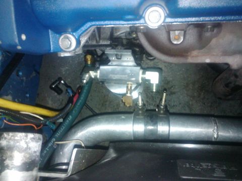 1995 Ford Probe - Close-up view of engine components including a fuel filter and piping.