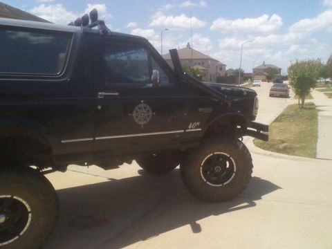 1995 Ford Bronco - This lifted SUV has a snorkel and a compass graphic on its door.