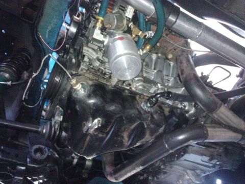 1995 Ford Probe - Custom engine modifications are visible in this close-up shot, including turbo piping and an oil cooler.