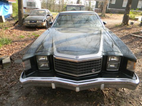 1979 Ford Ranchero - The front of a 1977 Ford Ranchero GT is shown, parked outdoors with another vehicle in the background.