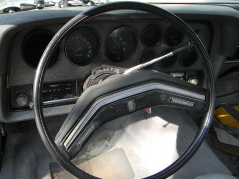 1979 Ford Ranchero - The interior of a 1979 Ford Ranchero shows the dashboard, steering wheel, and radio.
