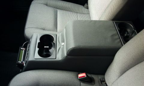 2007 Ford Crown Victoria - It has a nice thick padded arm rest. And a spacious console bin. Front cup holders are nice and deep. The rears are half as deep.
