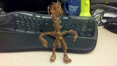 1979 Ford F-150 - Wire sculpture of a person on a desk with a keyboard and mug in the background.