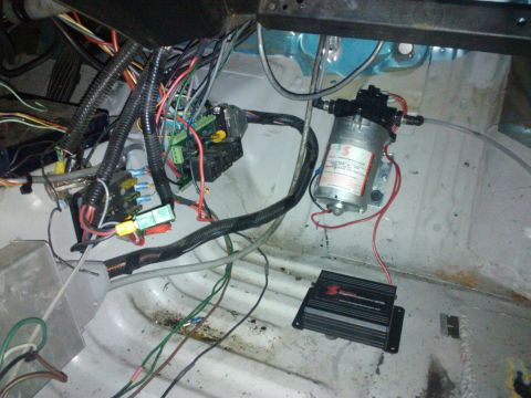 1995 Ford Probe - Custom wiring and pump installation in a vehicle's interior.