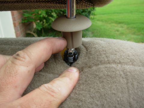1994 Ford Crown Victoria - The first step is to get the headrests off. The bezels unscrew to make accessing the clips easier.