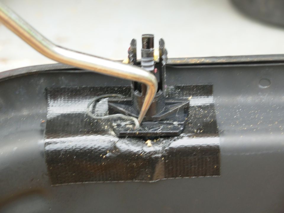 The clips can't be seen with the upholstery in place, but this what has to be done: the clips need to come out of their slots so the headrest can come out.