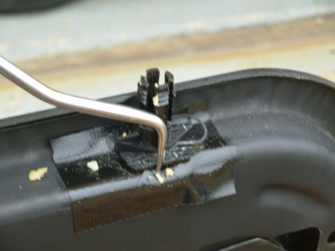 1994 Ford Crown Victoria - The clips can't be seen with the upholstery in place, but this what has to be done: the clips need to come out of their slots so the headre…