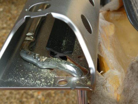 1994 Ford Crown Victoria - This is a PITA. I used the same hose hook to push the back edge down out of the slot. Putting it back in after cleaning was at least as har…