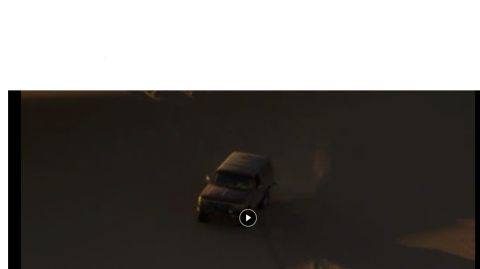 1994 Ford Bronco - An SUV navigates a dusty, outdoor path, captured with a Supermotors.net watermark.