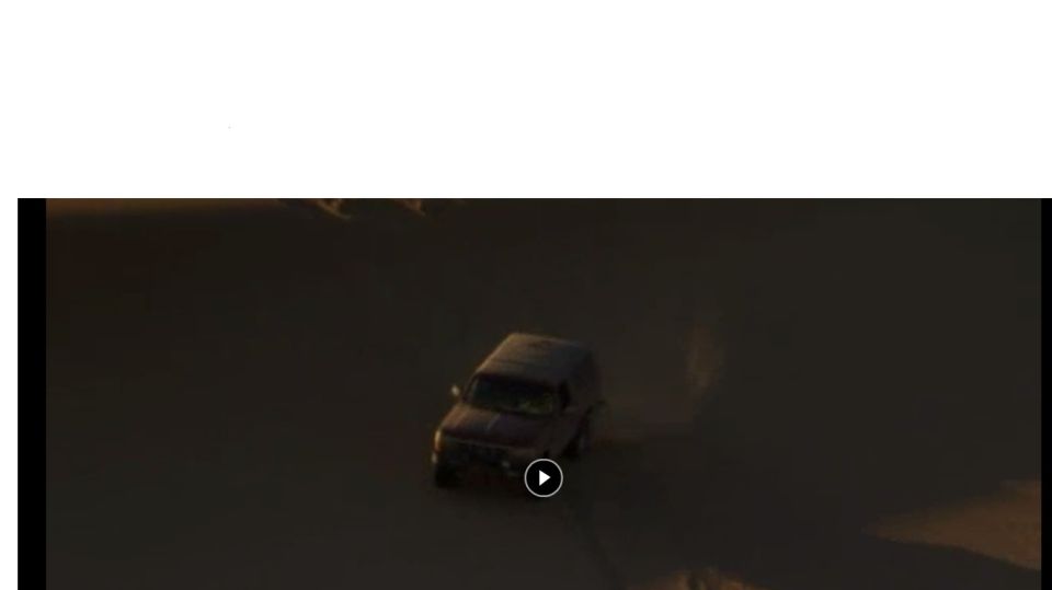 SUV driving on a dirt road, with a play button overlay and Supermotors.net watermark