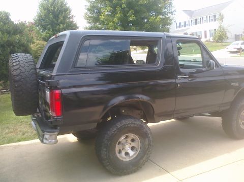 1995 Ford Bronco - This 1995 Ford Bronco is shown from the rear quarter angle, a spare tire on the back.