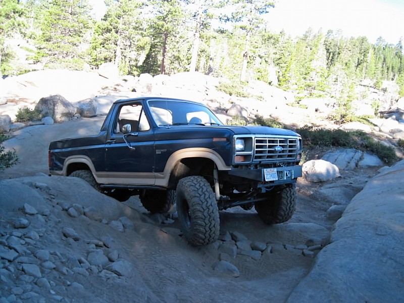 1986 Ford Bronco 3q-front view on rocky terrain