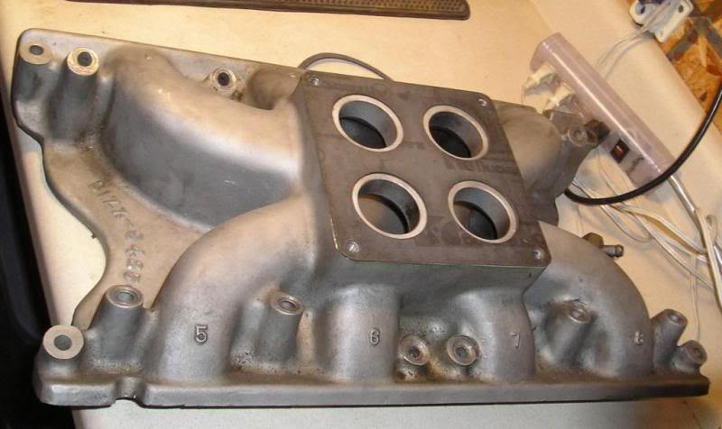 originally cast as a 4 hole flange because the Dominator carb has an internal linkage that can possibly drop into an open plenum