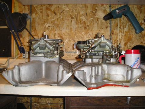 1972 Ford Ranchero - Two automotive intake manifolds with carburetors are displayed, one showing red gasket material.