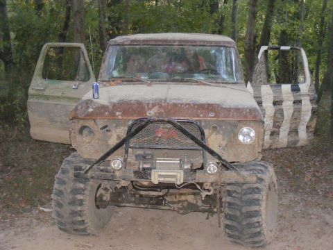 1978 Ford Bronco - This heavily modified 1978 Ford Bronco is ready for off-road adventures, with its doors wide open and covered in mud.