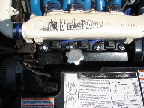 1992 Ford Taurus - Engine bay details include a "5.0 VALVE DOHC" intake manifold and a Ford Motor Company emission control sticker.