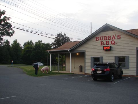 1992 Ford Taurus - A black SUV is parked in the lot of Bubba's B.B.Q. restaurant.