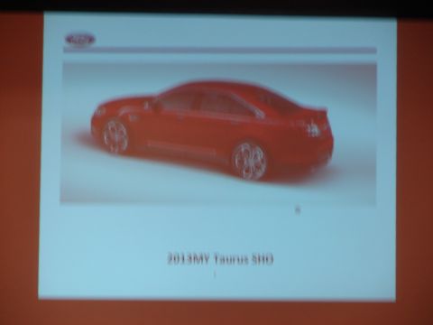 1992 Ford Taurus - A red sedan, identified as a 2013 Taurus SHO, is shown in a 3/4 front view.