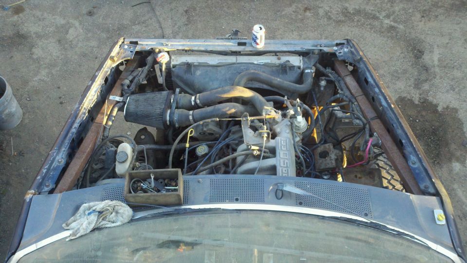 1989 Ford Bronco engine bay with aftermarket air filter and V8 engine