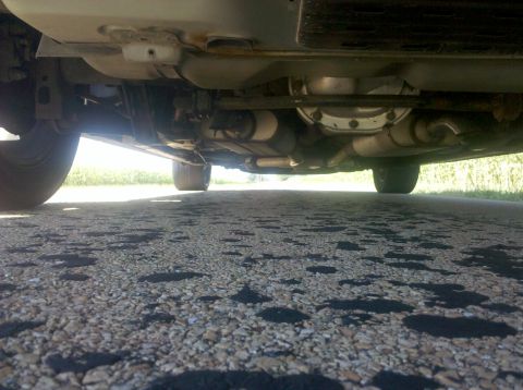 1999 Mercury Grand Marquis - Underside view of a car, revealing its exhaust and drivetrain components.