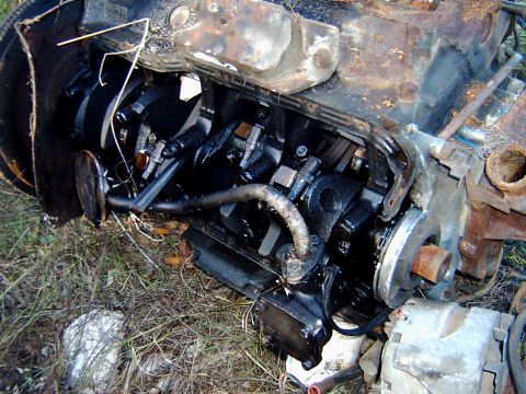 1982 Ford Bronco - Disassembled engine block with visible crankshaft and internal components.