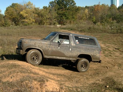 1982 Ford Bronco - This muddy 1980s Ford Bronco navigates an off-road course.