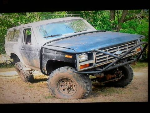 1986 Ford Bronco - This modified Ford Bronco is equipped for off-road use with a heavy-duty brush guard and large tires.