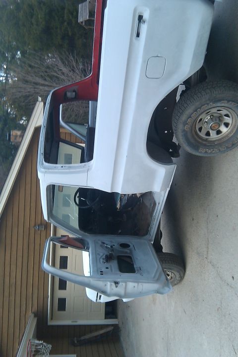 1978 Ford Bronco - This vehicle appears to be undergoing restoration, with its doors removed and body in primer.