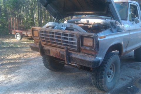 1978 Ford Bronco - This 1978 Ford Bronco is shown from the front with its hood open, revealing the engine compartment.