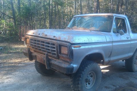1978 Ford Bronco - This 1978 Ford Bronco is seen from a 3/4 front angle, parked in a wooded area.