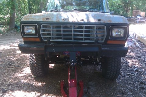 1978 Ford Bronco - Front view of a 1978 Ford Bronco showing its grille, headlights, and off-road tires.
