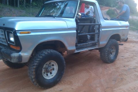 1978 Ford Bronco - This 1978 Ford Bronco has a roll cage and off-road tires, suggesting it is used for off-roading.