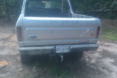 1978 Ford Bronco - Rear view of a 1978 Ford Bronco, showing its tailgate with various stickers and a Georgia license plate.