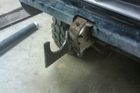 1978 Ford Bronco - A close-up view of a custom tow hook modification on a vehicle's rear bumper.