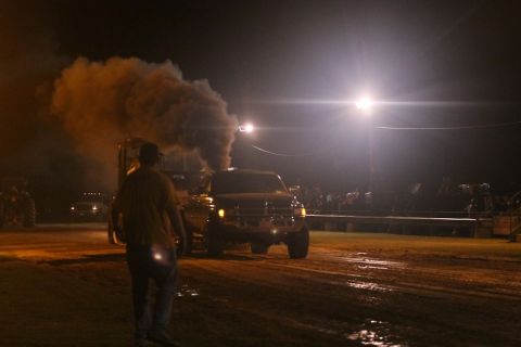 1997 Dodge 2500 - A 1997 Dodge 2500 truck is seen at night, emitting a large cloud of black smoke from its exhaust.