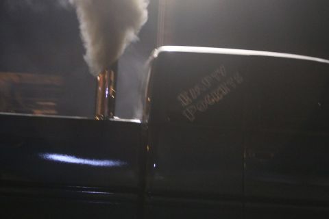 1997 Dodge 2500 - A truck's side profile shows a large exhaust pipe spewing smoke, with custom lettering on the door reading "Empty Pockets".
