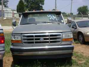 1995 Ford Bronco - Front view of a 1995 Ford Bronco, showing its grille and headlights.