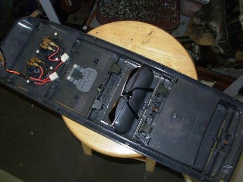 1997 Chevrolet Silverado 3500 - This console has a hard cover for mounting a garage remote, which is then activated by the gray button.