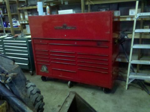 2003 Ford F-250 - A large red Matco tool chest is shown in a workshop setting, with other tool chests and equipment visible in the background.