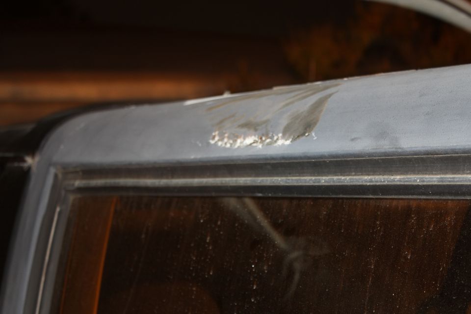 Damaged roofline above window on vehicle
