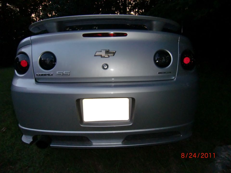 Rear view of a silver 2009 Chevrolet Cobalt SS with tinted taillights and a spoiler