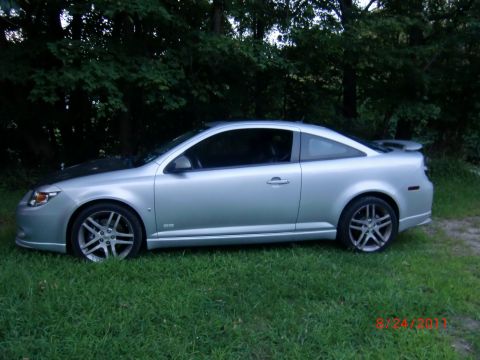 2009 Chevrolet Cobalt - Side view of a silver 2009 Chevrolet Cobalt coupe with a spoiler.