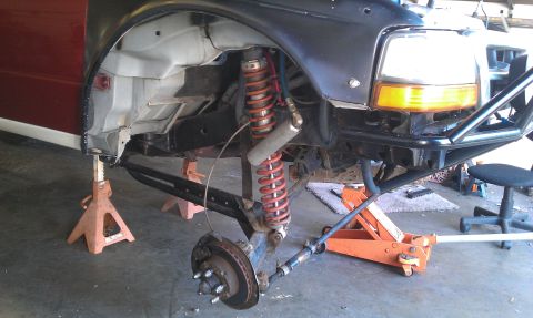 1992 Ford Ranger - The front suspension of a 1992 Ford Ranger is shown while on jack stands, indicating ongoing work or modification.