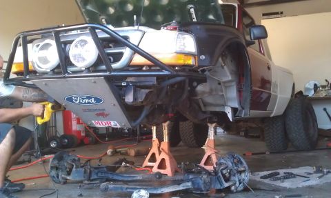 1992 Ford Ranger - A 1992 Ford Ranger is undergoing suspension work, a custom off-road bumper and dual rear wheels.