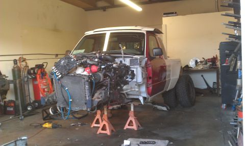 1992 Ford Ranger - 1992 Ford Ranger in shop for repairs, front end disassembled and engine removed.