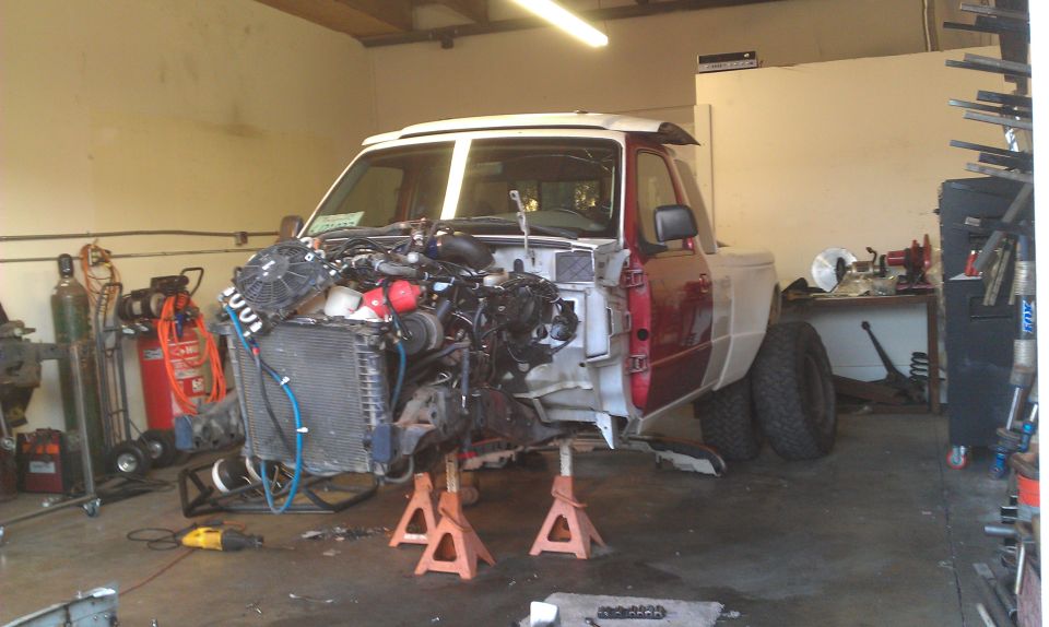 1992 Ford Ranger chassis on jack stands, engine bay empty, front clip removed