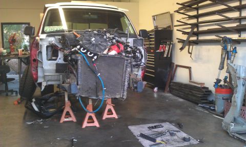1992 Ford Ranger - Front end of a 1992 Ford Ranger undergoing repairs or modifications in a garage setting.