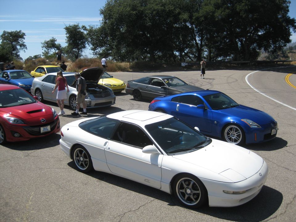 White 1990 Ford Probe coupe with pop-up headlights