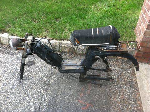1981 Garelli Rally Sport - This appears to be a Garelli moped frame with the seat and front fork attached, resting on asphalt.