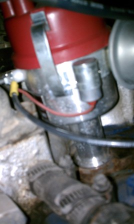 1978 Ford Bronco - Close-up of a vehicle's distributor cap and wiring, showing engine components.